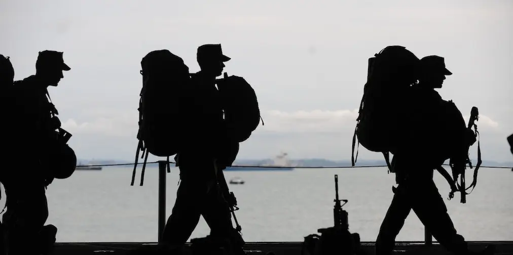 silhouette of soldiers walking